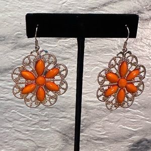 Large orange plastic rhinestone flower earrings